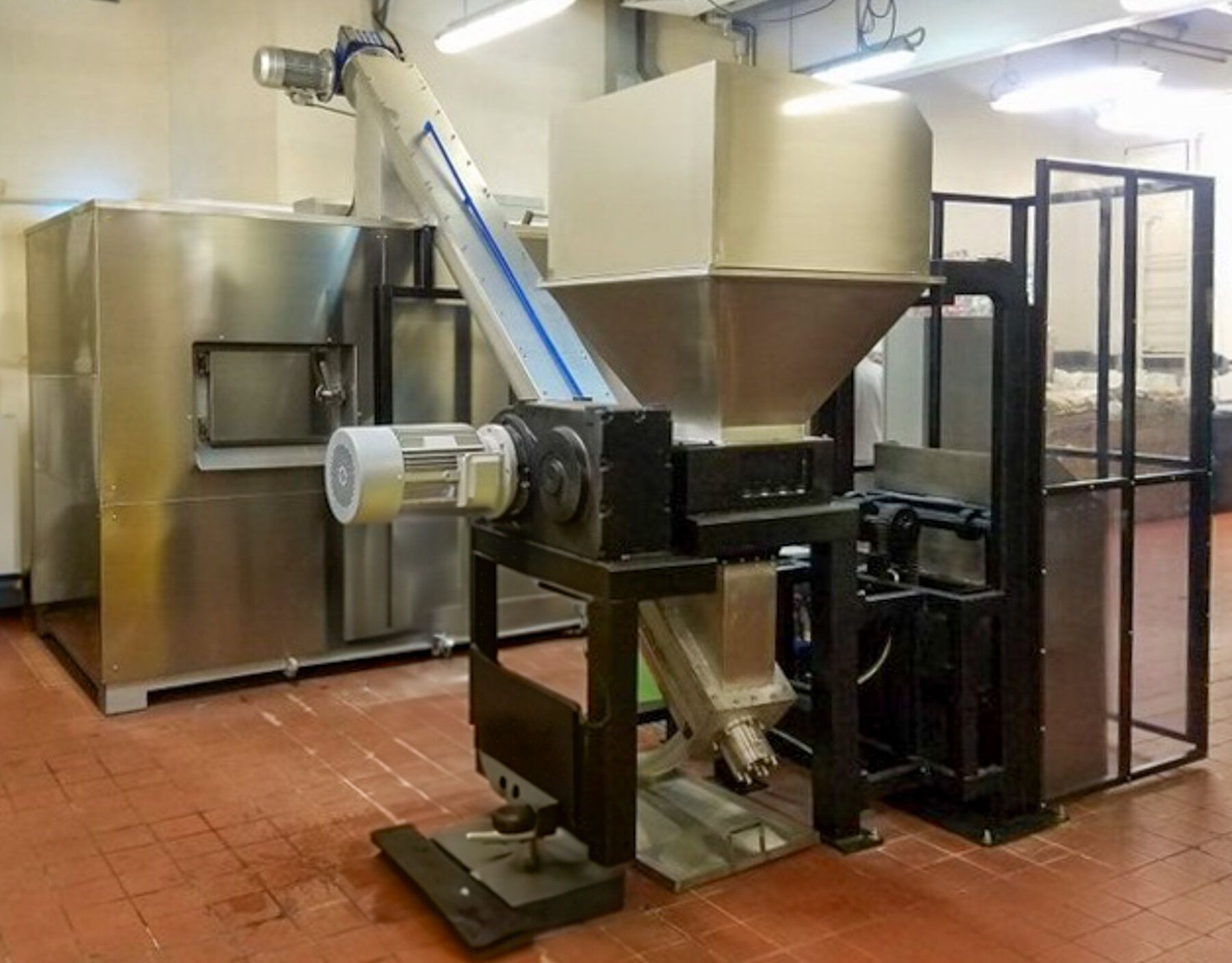 GRØNBLÅ in-vessel compost machine installed on-site at a venue